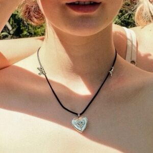 black leather heart locket necklace with silver accents